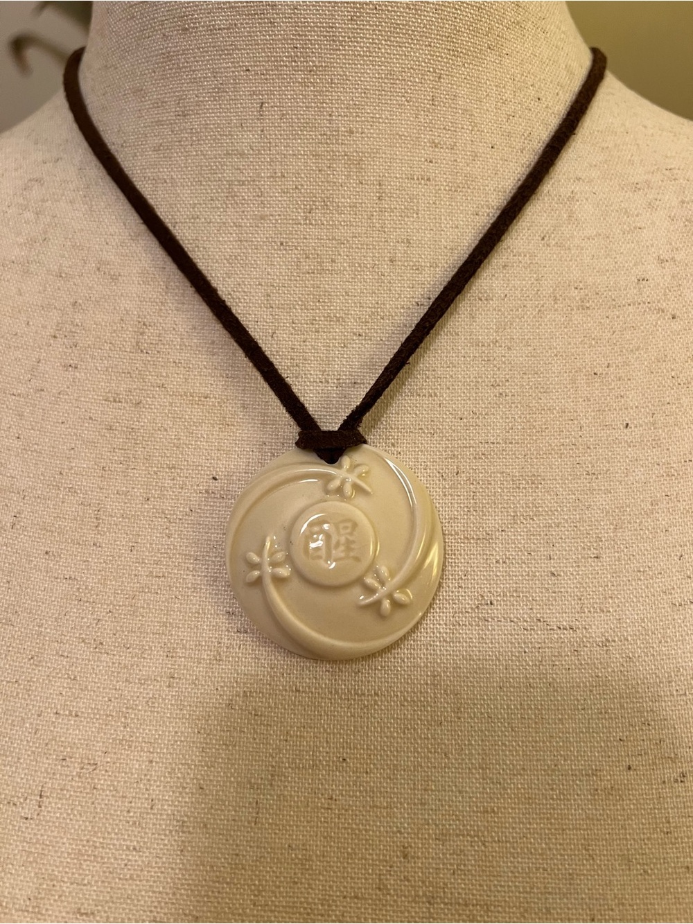 Cream Floral Asian Ceramic Pendant Necklace on Dark Brown Suede Cord